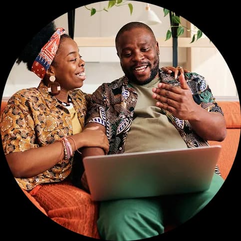 Parent and child looking at a laptop together